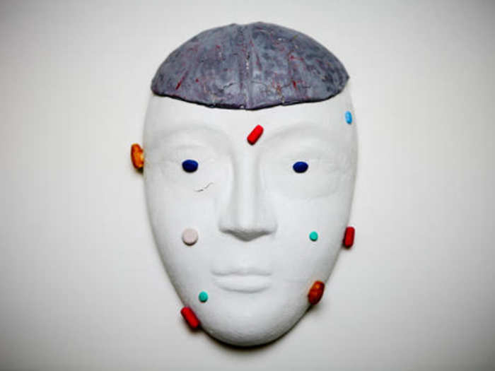 This mask shows what it feels like to be over-medicated, which the soldier depicts using the actual colors and shapes of the pills he had taken.