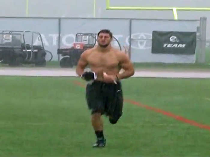 And a video of Tebow running shirtless through the rain.