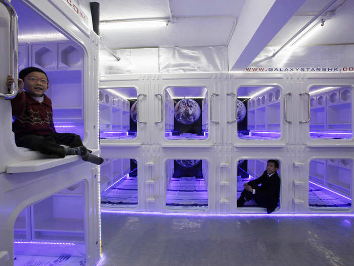 These capsule beds in Hong Kong have adjustable ceilings, an air conditioner and a TV. They cost $450 a month or $30 a night.