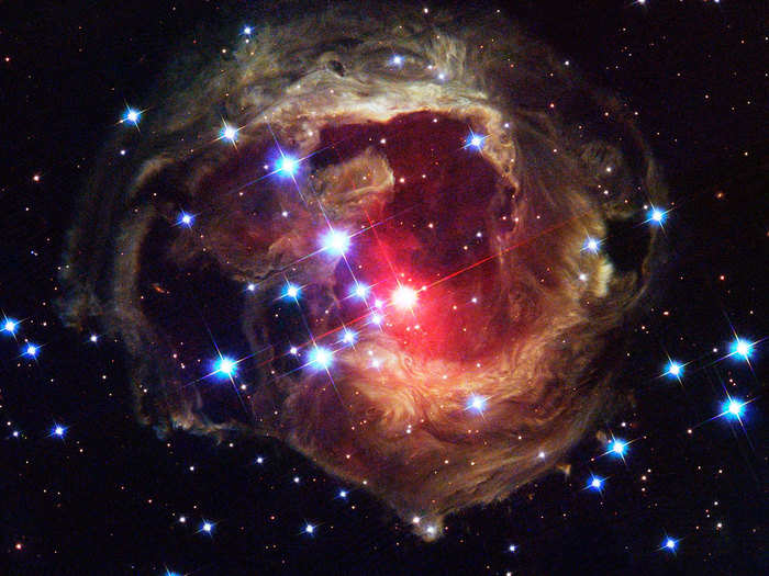 Light from a stellar explosion three years earlier illuminates surrounding dust. This is called a light echo.