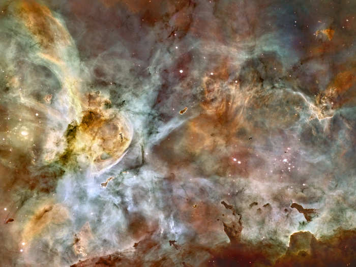 A view of the Carina Nebula that shows a region of star birth and death. This is one of the largest panoramic images ever taken with Hubble