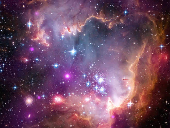 A young cluster of stars (NGC 602) located in the Small Magellanic Cloud (SMC), a satellite galaxy to the Milky Way.