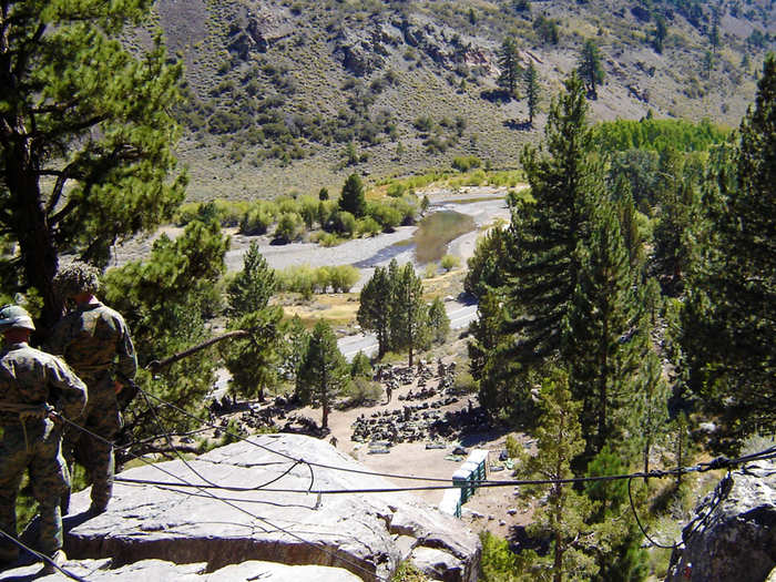 Learning how to safely rappel down a rock face ...