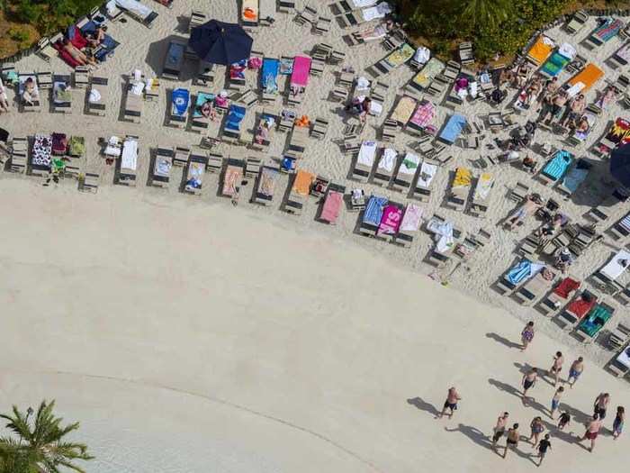 The Sandy White Beach at the Disney Typhoon Lagoon water park is the perfect place to rest and relax, with plenty of hammocks and lounge chairs available.