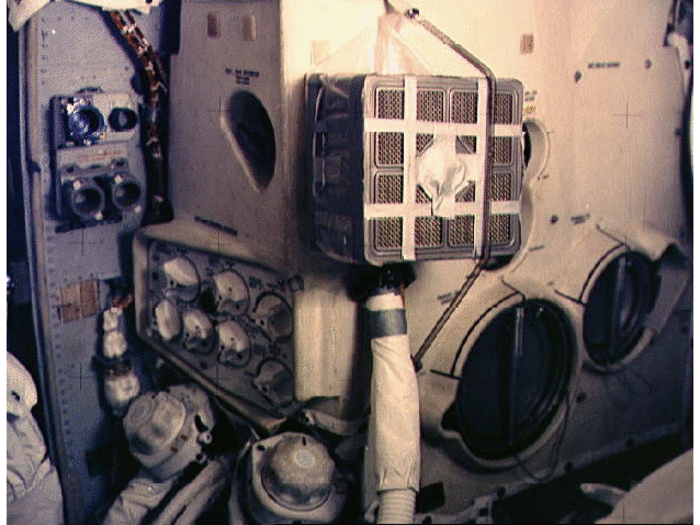 After a day and a half in the lunar module, a warning light goes off showing dangerous levels of carbon dioxide. The crew could use the canisters used to remove carbon dioxide from the command module, but there was one problem: The command module used square canisters, while the lunar module used round ones.