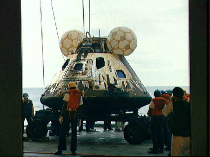 After the crew is safely on the ship, the command module is pulled on board.