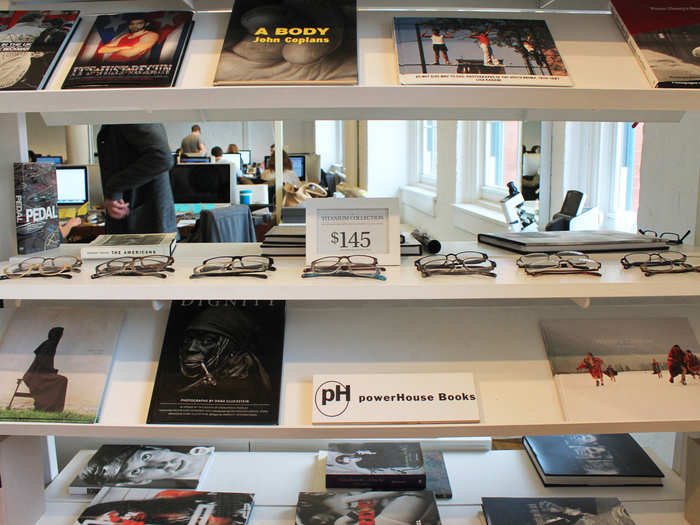 The Warby Parker titanium collection was arranged on the bookcases and surrounded by powerHouse Books.