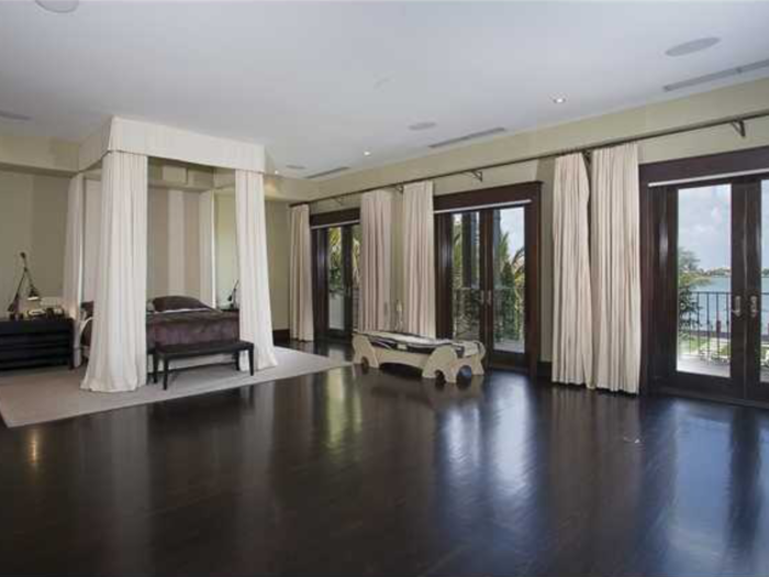 Seven bedrooms, including this master bedroom with views of the bay.