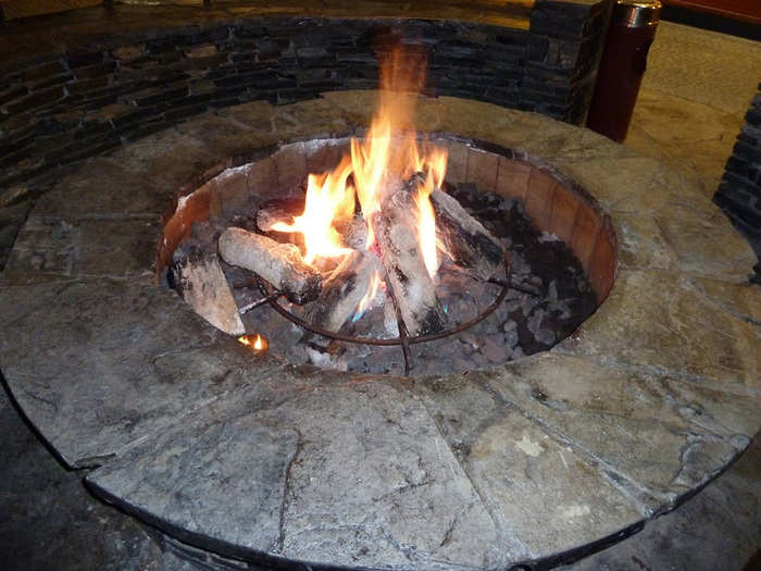 At night, people huddle around the central fire pit for warmth before heading to one of the resort