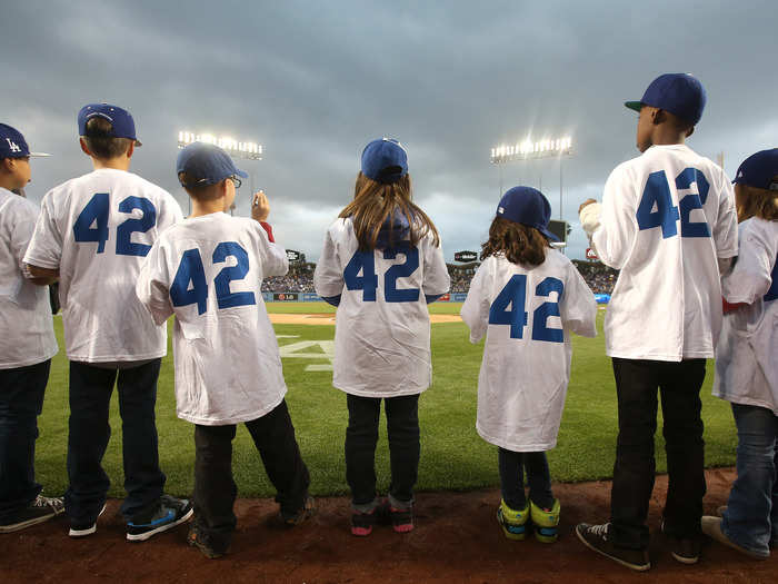 Children, all wearing no. 42, took part in the pre-game festivities