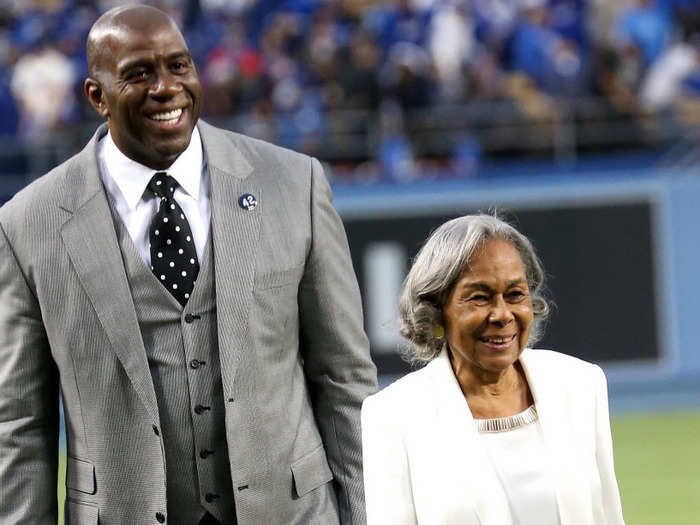 Rachel Robinson was all smiles with Magic Johnson prior to the game