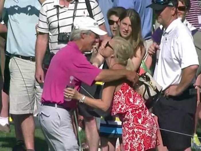 Julie Crenshaw gave her husband Ben a smooch after he hit a hole in one at the Par 3 Contest