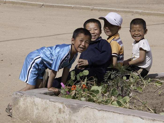 A group of young boys get curious with me in the township of Eunheung in Kaema-gowon near the Baekdu Daegan in Yanggangdo, DPRK.