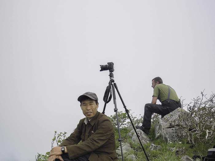 Me checking out the next photo angle with Duryusan guide Mr. Pak Geum Chol. We carried an array of foods with us on our hikes, including wild honeys and potatoes we roasted over our camp fires.