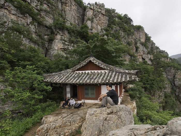 Chilling out after a hard climb up to Hyunam hermitage near Jangsusan mountain in Hwanghaenamdo province, DPRK.