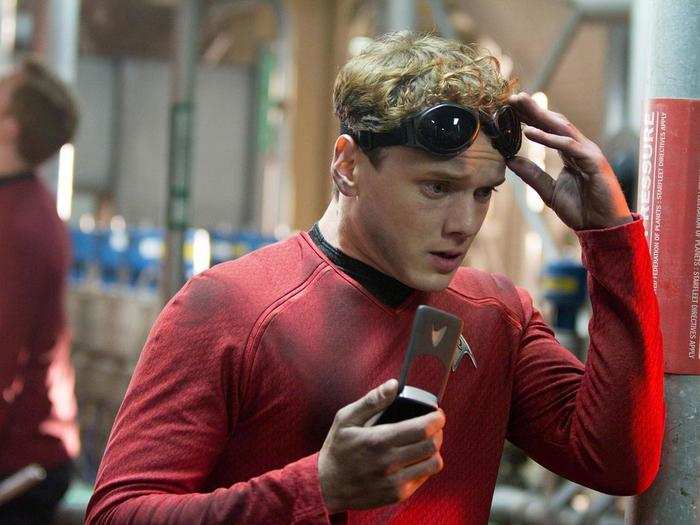 Looks like Pavel Chekov (Anton Yelchin) just received some bad news. Check out the Starfleet insignia on that phone.