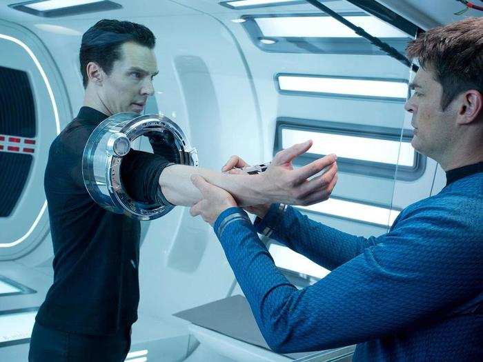 John Harrison (Benedict Cumberbatch) is either getting looked over or is being locked up in some high-tech handcuffs by Bones (Karl Urban). We