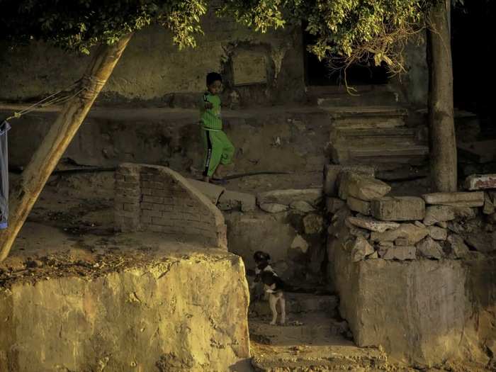 Glimpses of almost unimaginable lives. This is part of a community of dwellings built into the side of a hill aside a major thoroughfare.