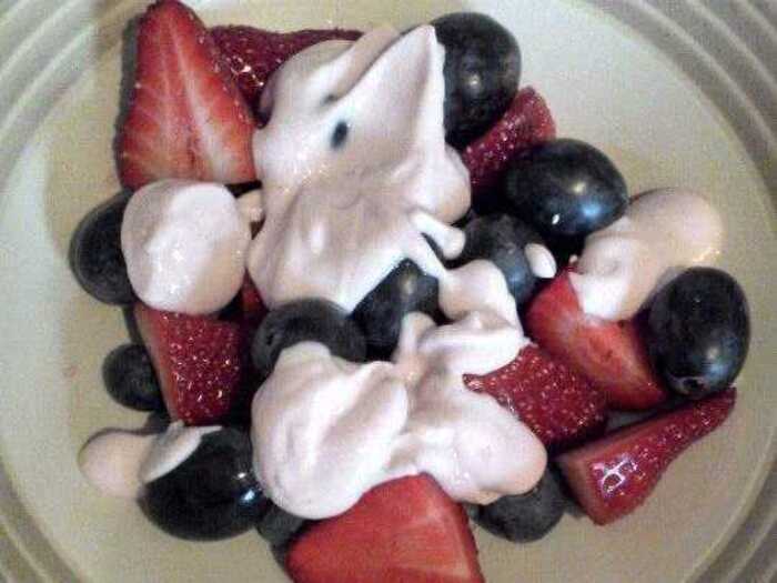 135 calories: A breakfast of strawberries, black grapes and  blueberries, and strawberry yogurt.