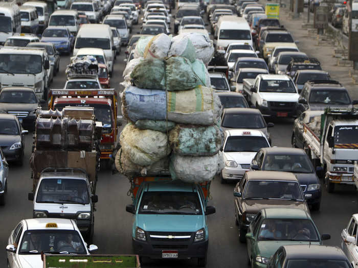 An overloaded vehicle is part of a traffic jam in Old Cairo.