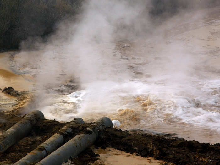 Polluted water from a rare earth smelting plant spews into a tailings dam near Xinguang Village. China supplies 97 percent of rare earths used worldwide, which are used for magnets, bearings and high-tech components that go into computers, vehicles and, increasingly, clean energy technology such as wind turbines and hybrid cars.