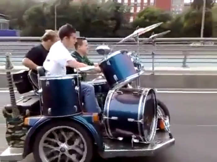 Guitar and Drums on the Sidecar of a Bike