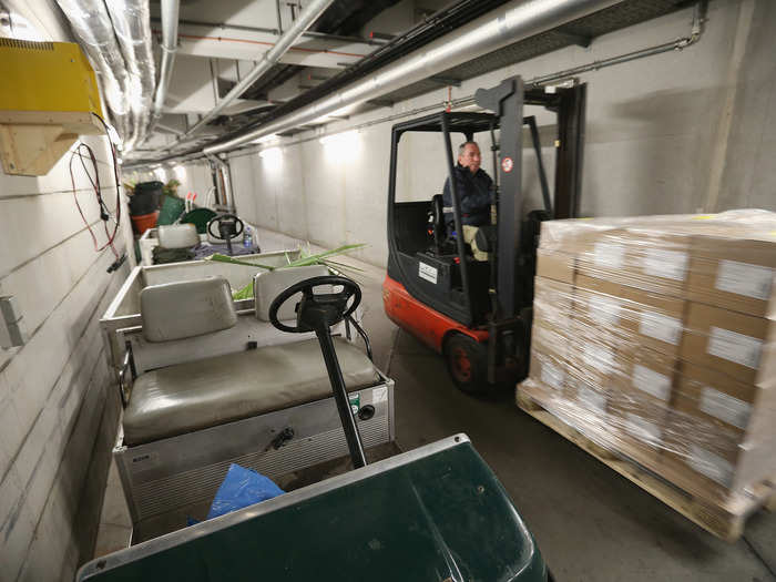 A lot of work goes into keeping the hangar up and running. Here, a worker transports materials through the underground tunnels below the resort.