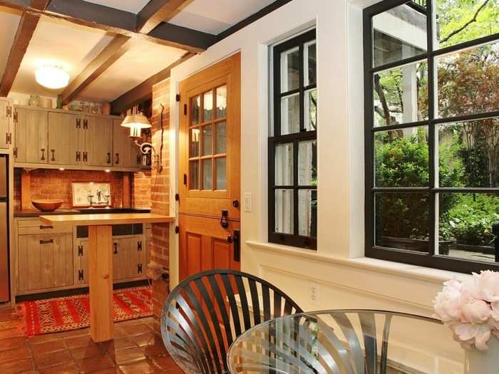 Big windows in the breakfast nook look out into the garden.