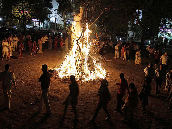 Indians perform rituals around a bonfire in Ahmadabad, India.