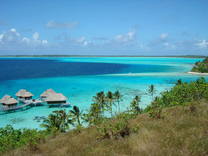 #4 - The main attraction at the Four Seasons Bora Bora is the gorgeous overwater bungalows with volcanic stone walls, teak furniture, and attached private pools.