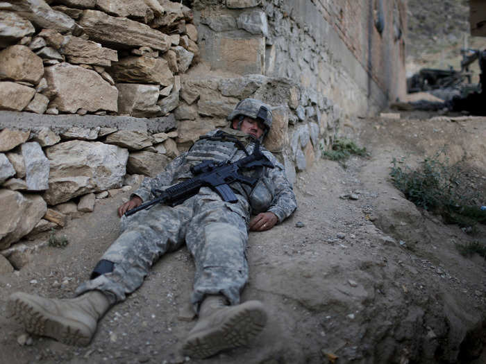 A U.S. soldier of Task Force Mountain Warriors sleeps in a base in Chapadera, at the Pesh Valley in Kunar Province August 5, 2009.