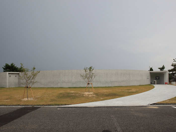 Ito designed the Ken Iwata Mother and Child Museum in 2011. The outside resembles a fort or prison, but the center is an open grassy area. It is also located next to the sea in Imabari, Japan.