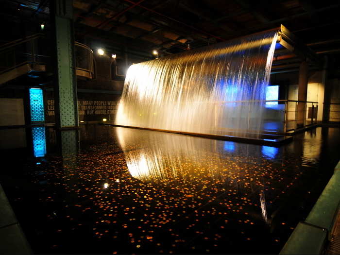 Water! A waterfall at the Guinness museum is full of coins from around the world.