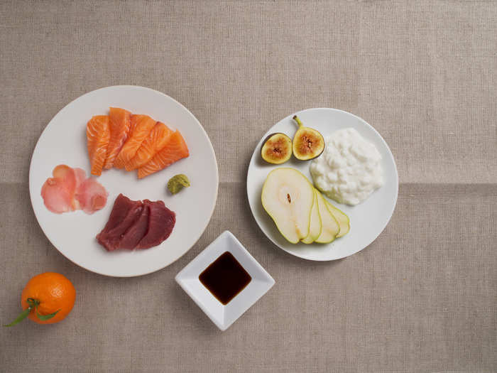 Here is an example of a 500-calorie meal: Breakfast includes cottage cheese, a sliced pear, and a fresh fig. Dinner is salmon and tuna sashimi with soy sauce, wasabi, pickled ginger, and a tangerine.