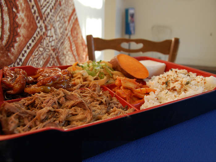 HAWAII: Savor a mouthful of traditional, slow-roasted Kalua pork with a side of fried rice.