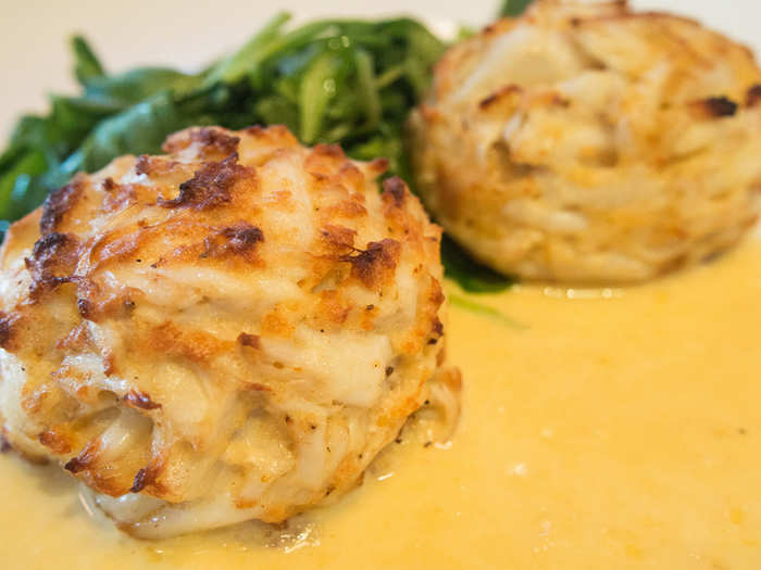 MARYLAND: Indulge in a tender, buttery crab cake lightly spiced with Old Bay seasoning, a Maryland original blend of herbs and spices.