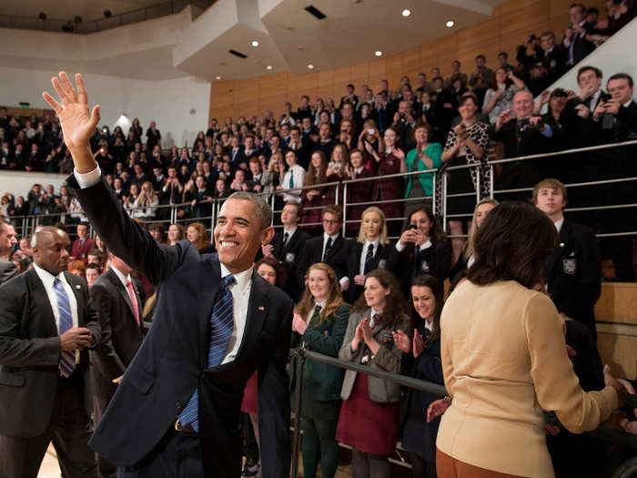 Obama and First Lady Michelle Obama greet audience members following the President