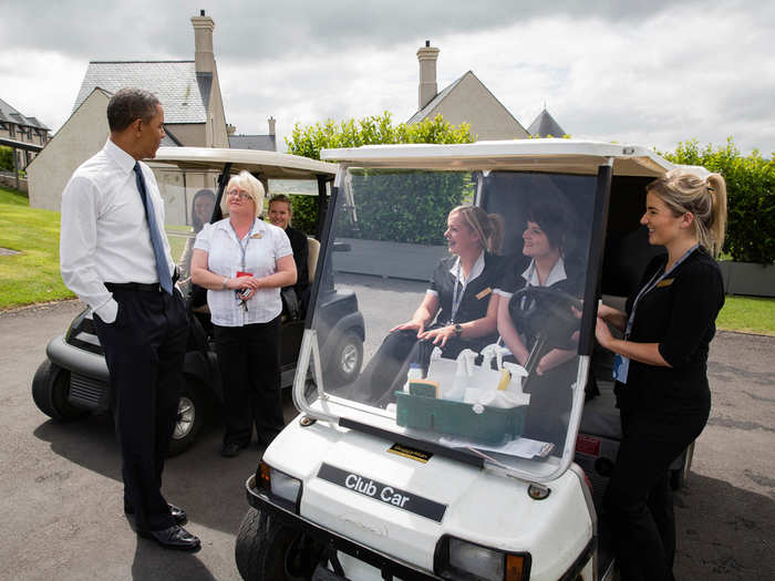 Obama talks with housekeeping staff outside of a lodge at the Lough Erne Resort during the G8 Summit in Enniskillen, Northern Ireland.