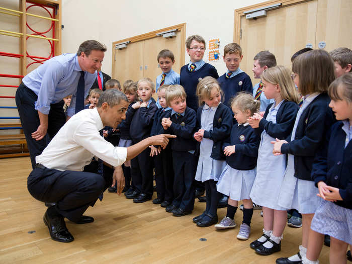 Obama and British Prime Minister David Cameron visit with students while touring Enniskillen Primary School in Enniskillen, Northern Ireland.