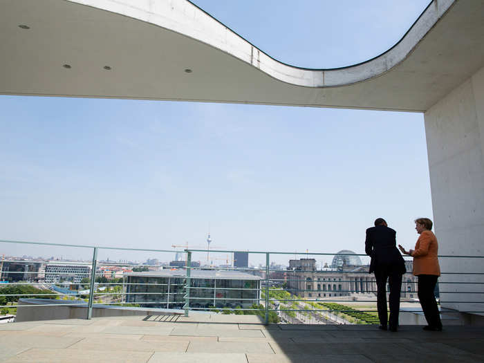 Obama and German Chancellor Angela Merkel talk on a balcony of the German Chancellery overlooking Berlin, Germany, on June 19.