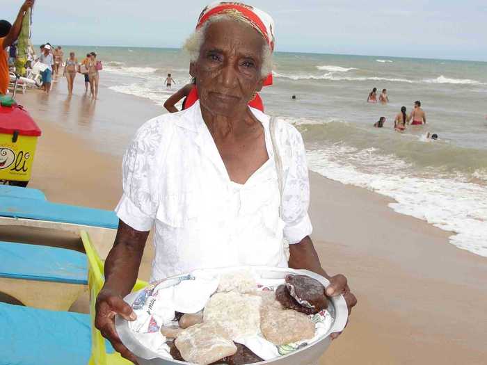 If you want a small snack before lunch there are always vendors, like this 90-year-old woman, wandering the beach and selling homemade coconut sweets.