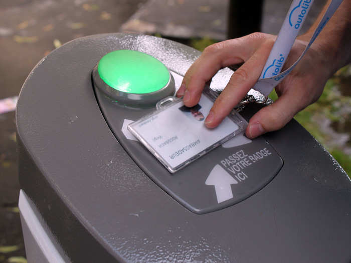 To take a car, press your badge against the charger and unplug the cord. Your badge also unlocks the car door.