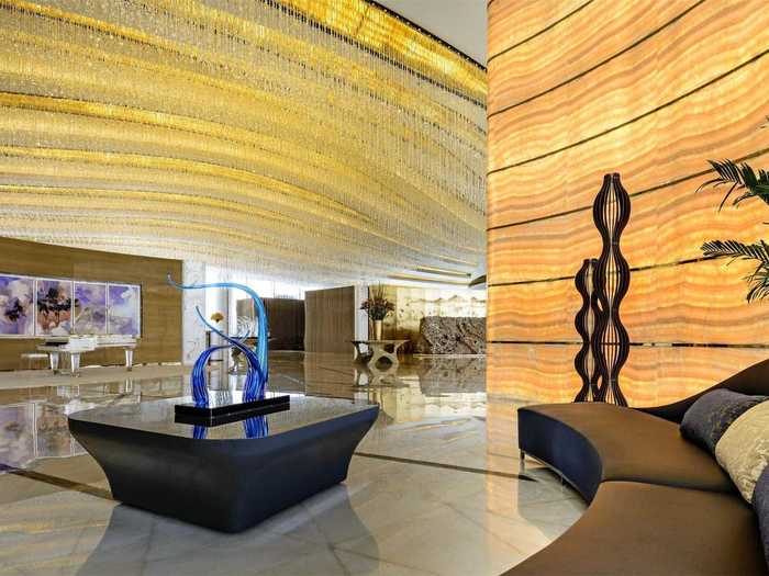 The lobby feels grandiose, with its marble floors, Swarovski crystal-encrusted ceiling, and crystal lamps.