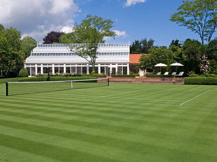 The property has its very own grass tennis court.