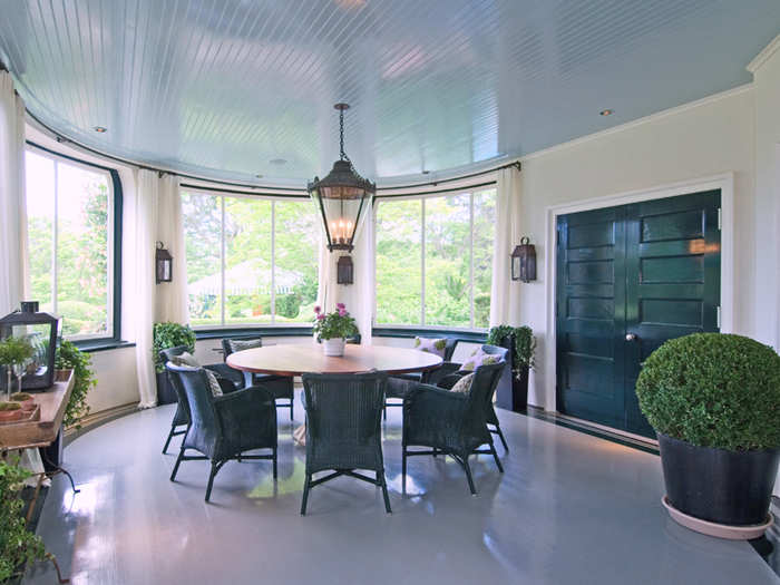 Or move lunch indoors: This screened dining porch provides the perfect amount of shade.