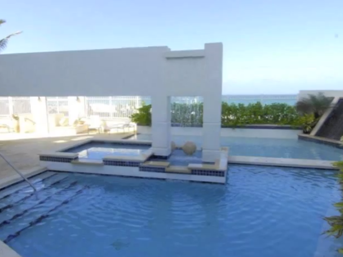 The upper level of the penthouse has an infinity pool and lounge with a full bar.