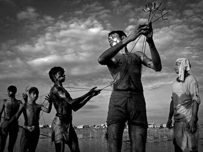 A group of young men celebrate a Hindu Festival devoted to the deities Shiva and Shakti in Moulvibazar, Bangladesh.