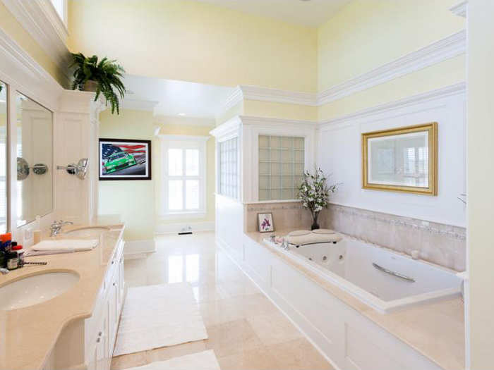 A bright master bathroom.