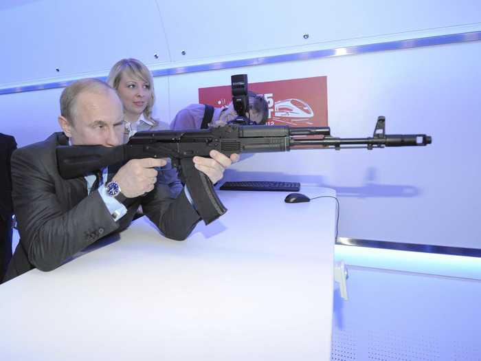 Here, Putin trains with an assault rifle simulator.