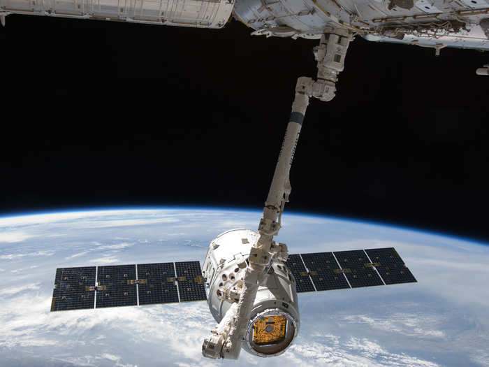 Once in space the BEAM will be taken out of the Dragon by a large robotic arm and attached to the ISS, as you see here.